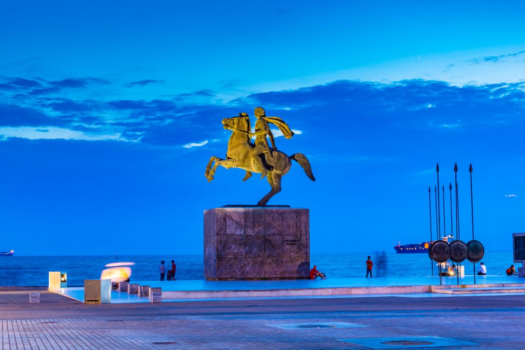 A Statue of Alexander the Great standing at the shore of Greece.