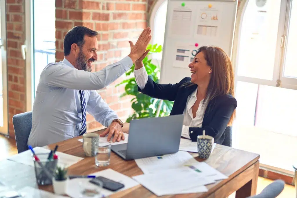 Victorious Coworkers doing a High Five